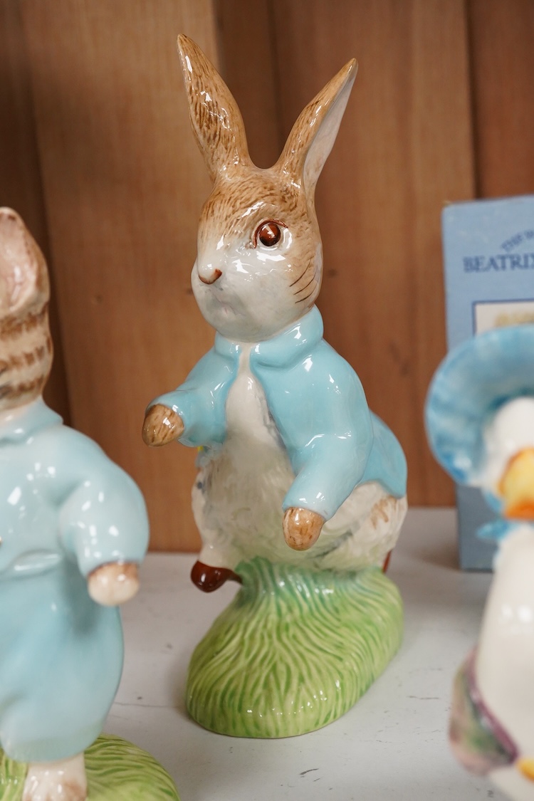 Nine Beswick Beatrix Potter figures, some stamped F. Warne & Co , largest 17cm high